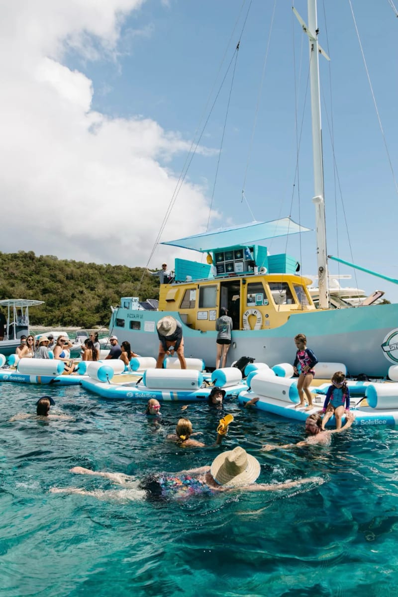 A woman and man preparing to scuba dive